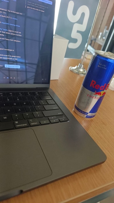 My old Slaab.ai desk — MacBook and a Red Bull